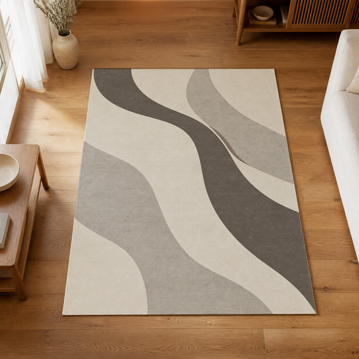 Kartela Flow washable modern wave area rug in Light Gray, on a wooden floor in a bright living room