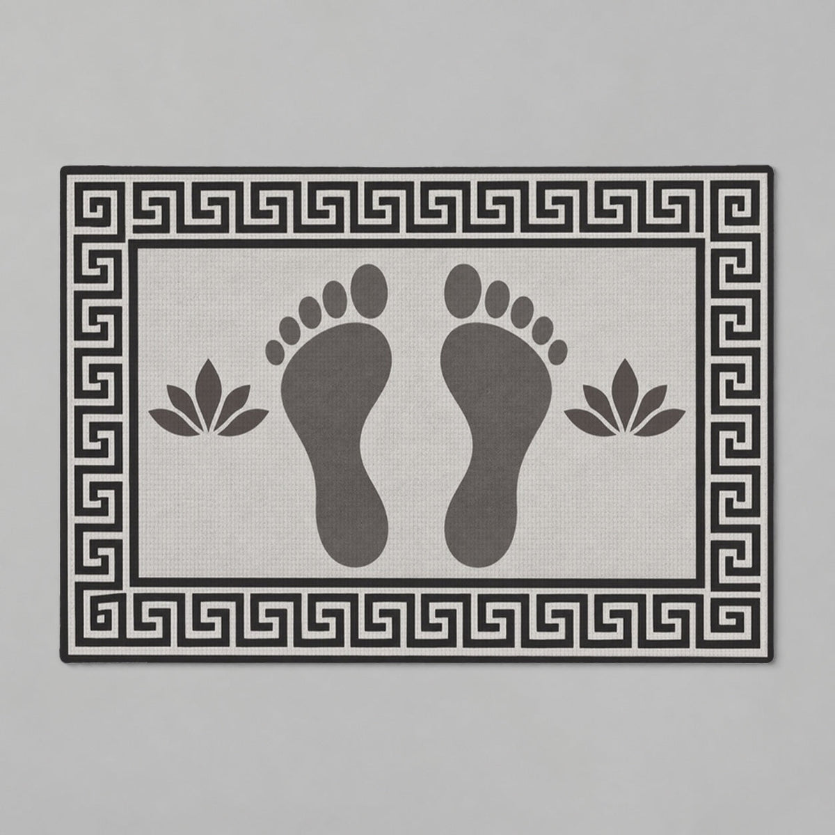 Kartela Footprints washable footprint bath mat in Charcoal, flat product view on a gray background