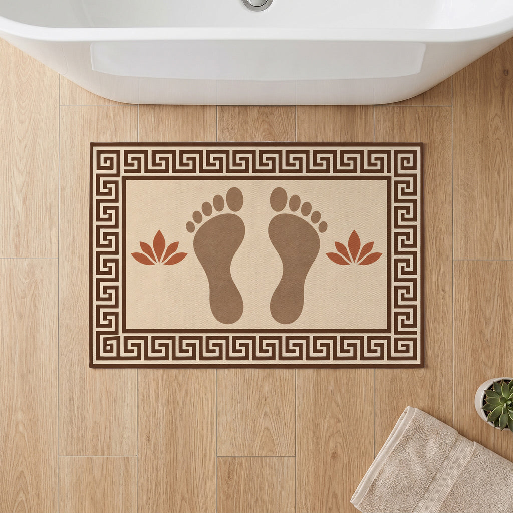 Kartela Footprints washable footprint bath mat in Beige, on a wooden floor in front of a bathtub