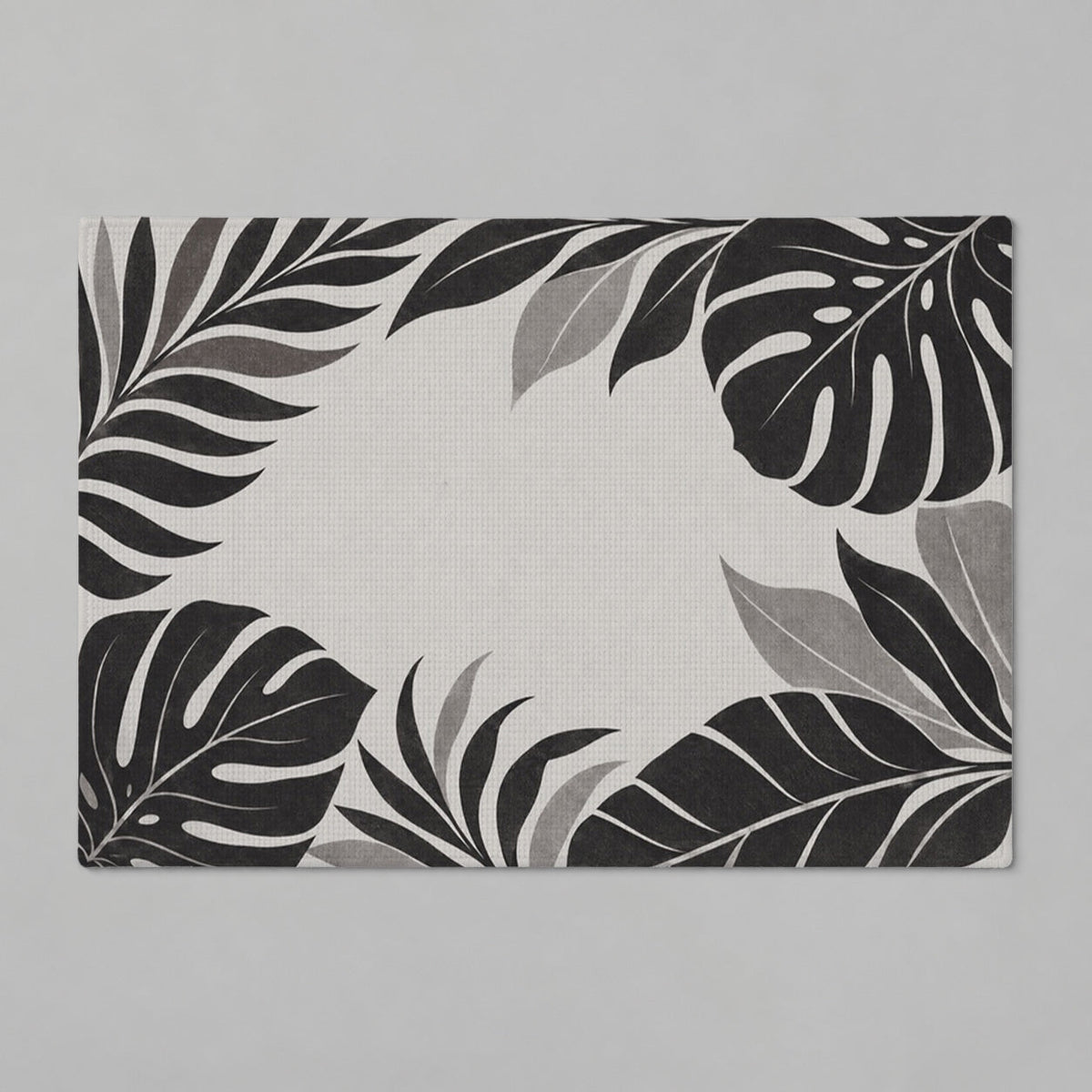 Kartela Monstera Frame washable tropical leaf bath mat in Charcoal, flat product view on a gray background