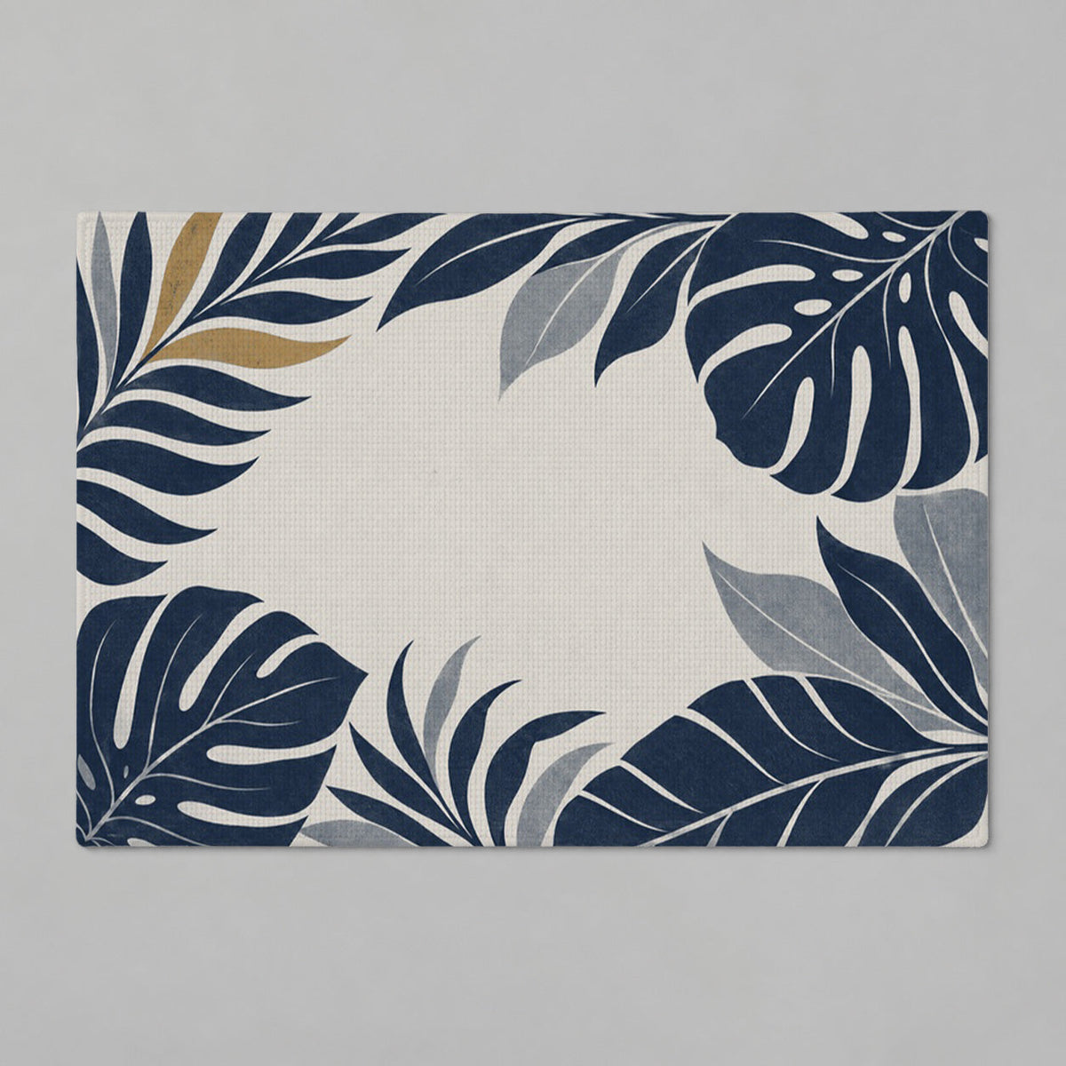 Kartela Monstera Frame washable tropical leaf bath mat in Navy, flat product view on a gray background