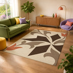 Kartela Tile Rhythm washable tulip motif area rug in Beige, in a sunny living room with a green sofa