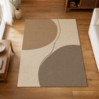 Kartela Balance washable abstract modern area rug in Beige, on a wooden floor in a bright living room