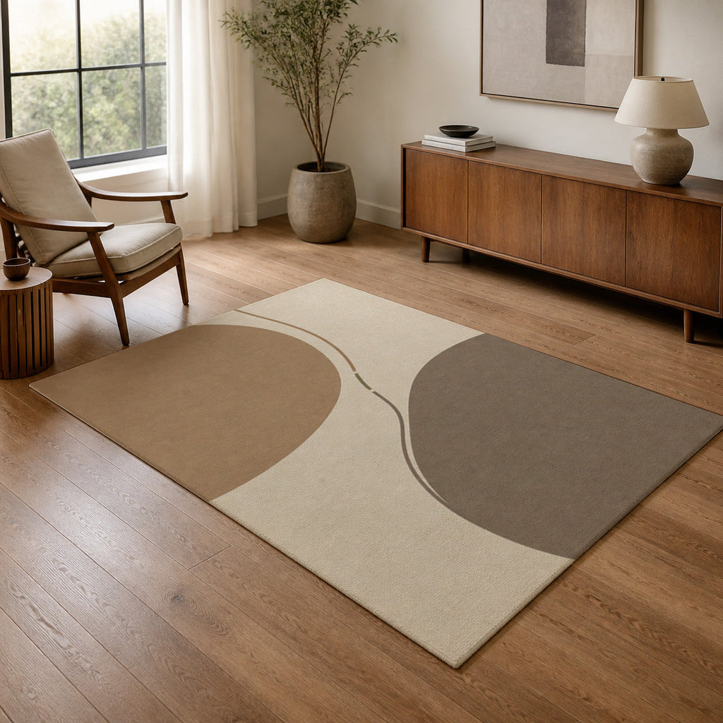 Kartela Balance washable abstract modern area rug in Beige, in a living room with an armchair and sideboard