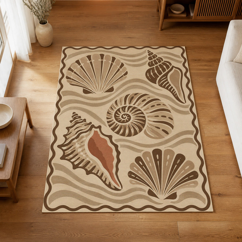 Kartela Seashell washable coastal seashell area rug in Beige, on a wooden floor in a bright living room