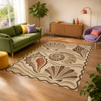 Kartela Seashell washable coastal seashell area rug in Beige, in a sunny living room with a green sofa