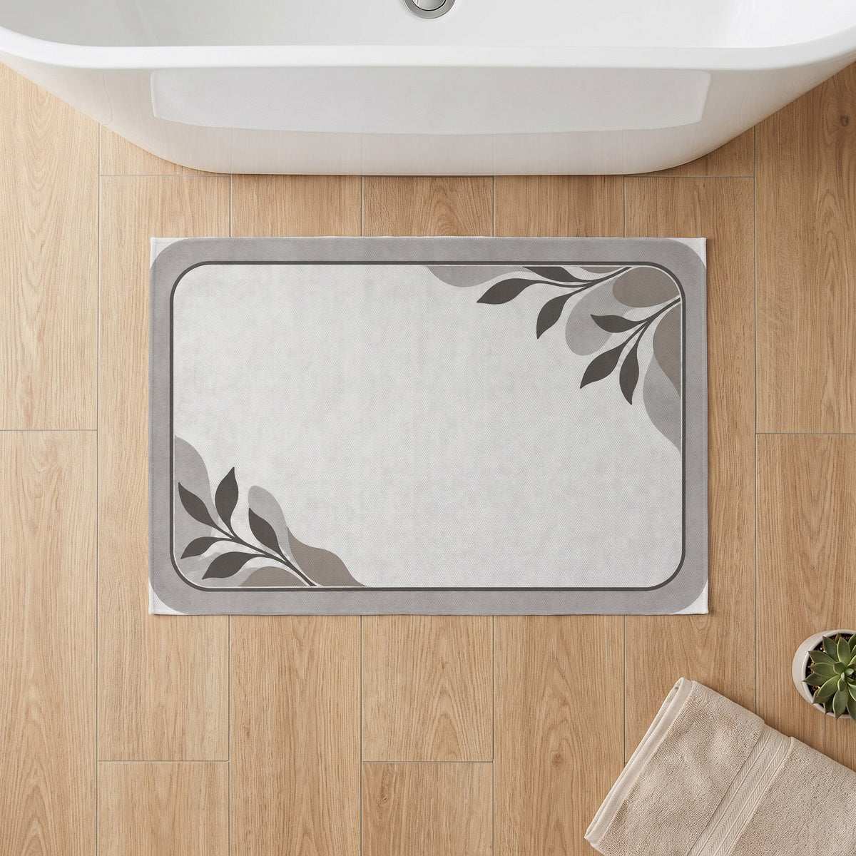 Kartela Diatomite washable stone-look bath mat in Light Gray, on a wooden floor in front of a bathtub