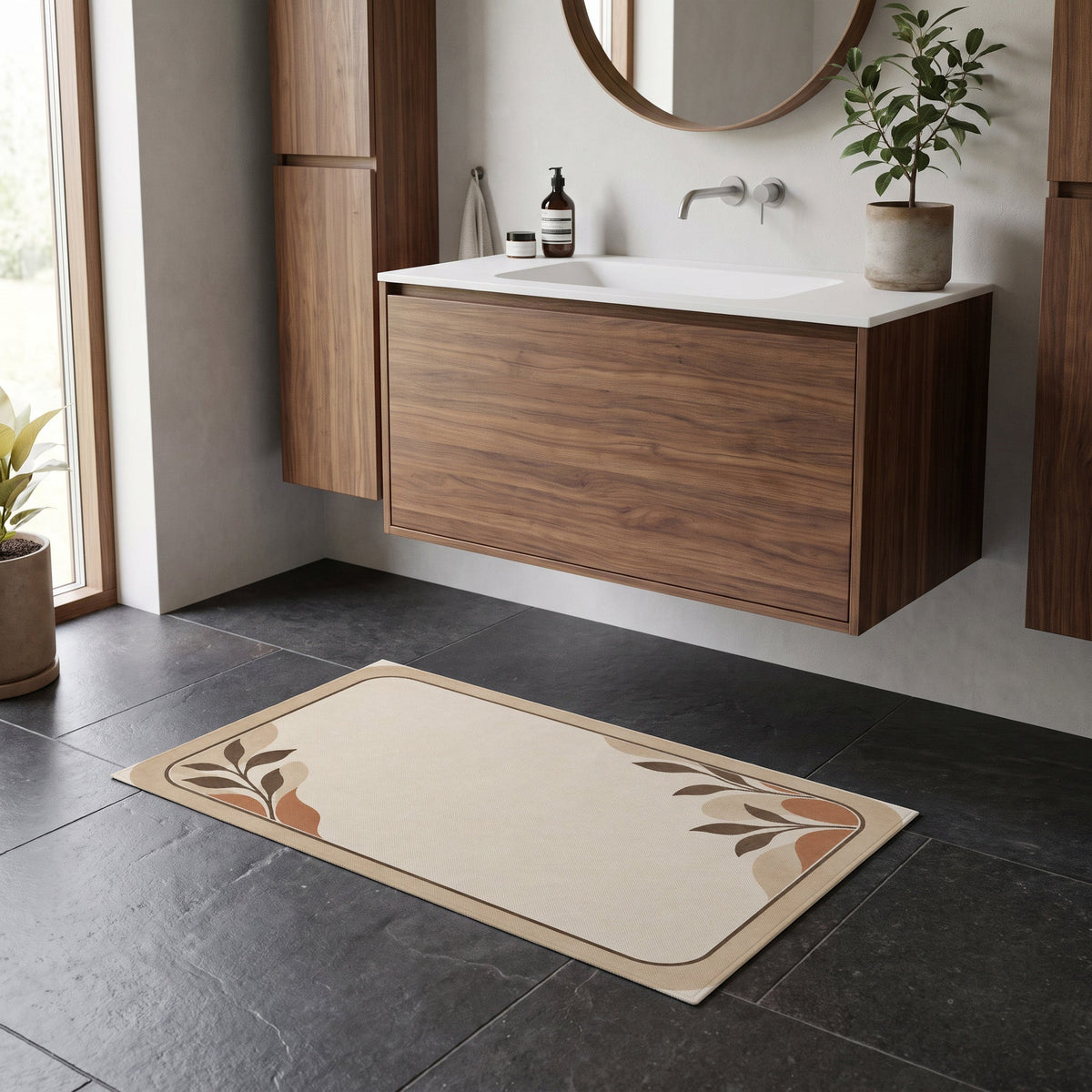 Kartela Diatomite washable stone-look bath mat in Beige, on a dark tile floor in front of a wooden vanity