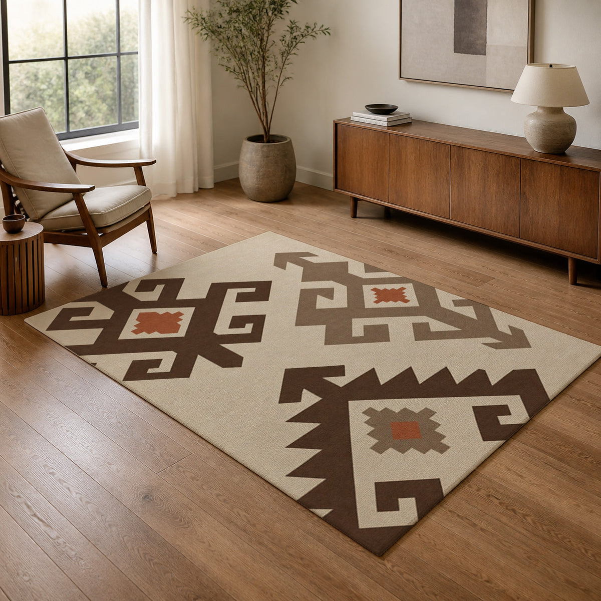 Kartela Woven Traces washable kilim pattern area rug in Beige, in a living room with an armchair and sideboard
