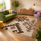 Kartela Woven Traces washable kilim pattern area rug in Beige, in a sunny living room with a green sofa