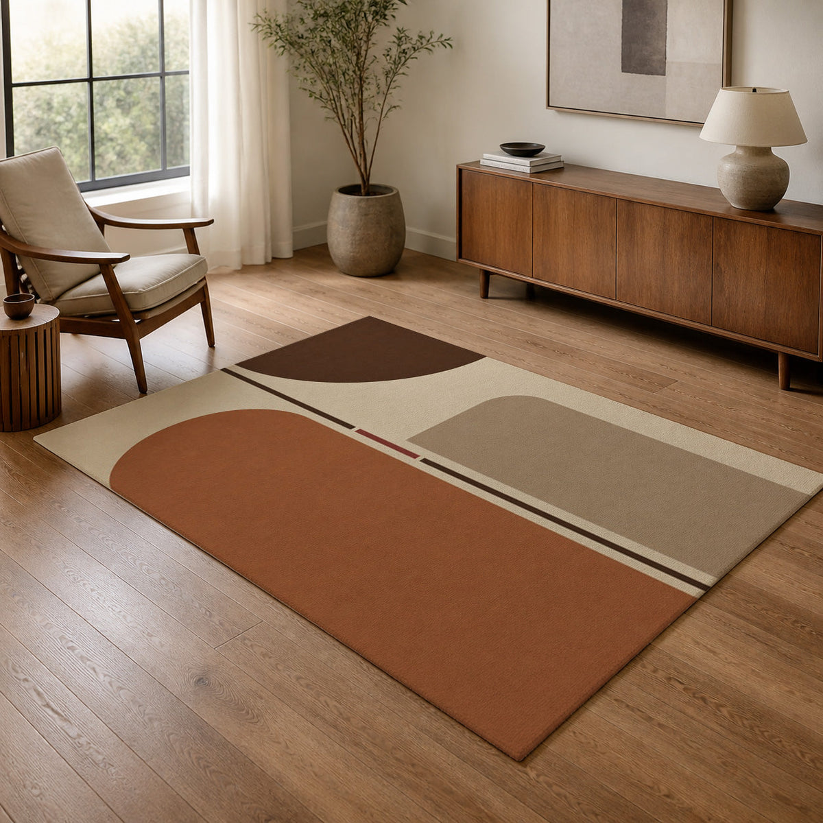 Kartela Axis washable modern arch area rug in Beige, in a living room with an armchair and sideboard
