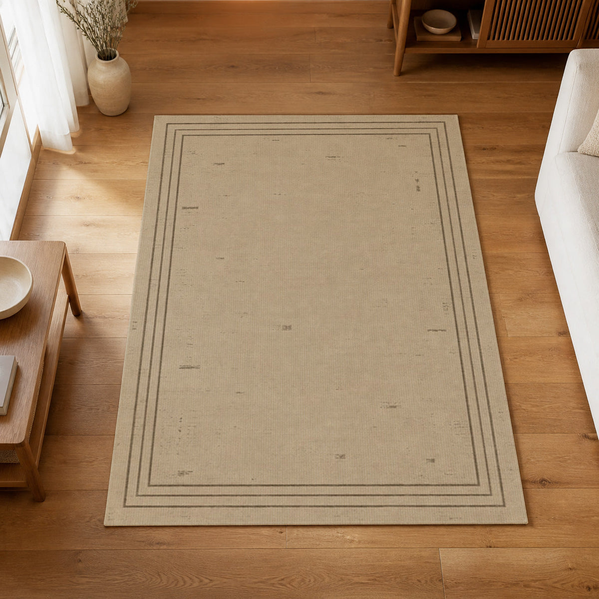 Kartela Weathered Line washable distressed bordered area rug in Beige, on a wooden floor in a bright living room