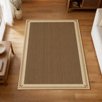 Kartela Fine Stripe washable striped bordered area rug in Beige, on a wooden floor in a bright living room