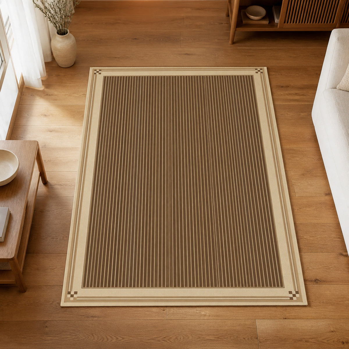 Kartela Fine Stripe washable striped bordered area rug in Beige, on a wooden floor in a bright living room