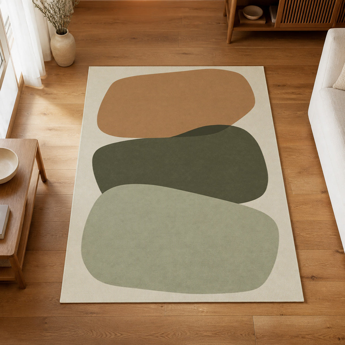 Kartela Cairn washable modern stone area rug in Sage Green, on a wooden floor in a bright living room