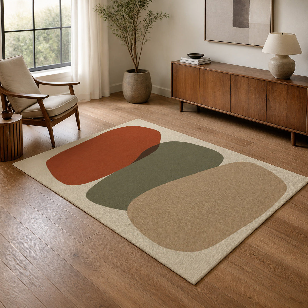 Kartela Cairn washable modern stone area rug in Beige, in a living room with an armchair and sideboard