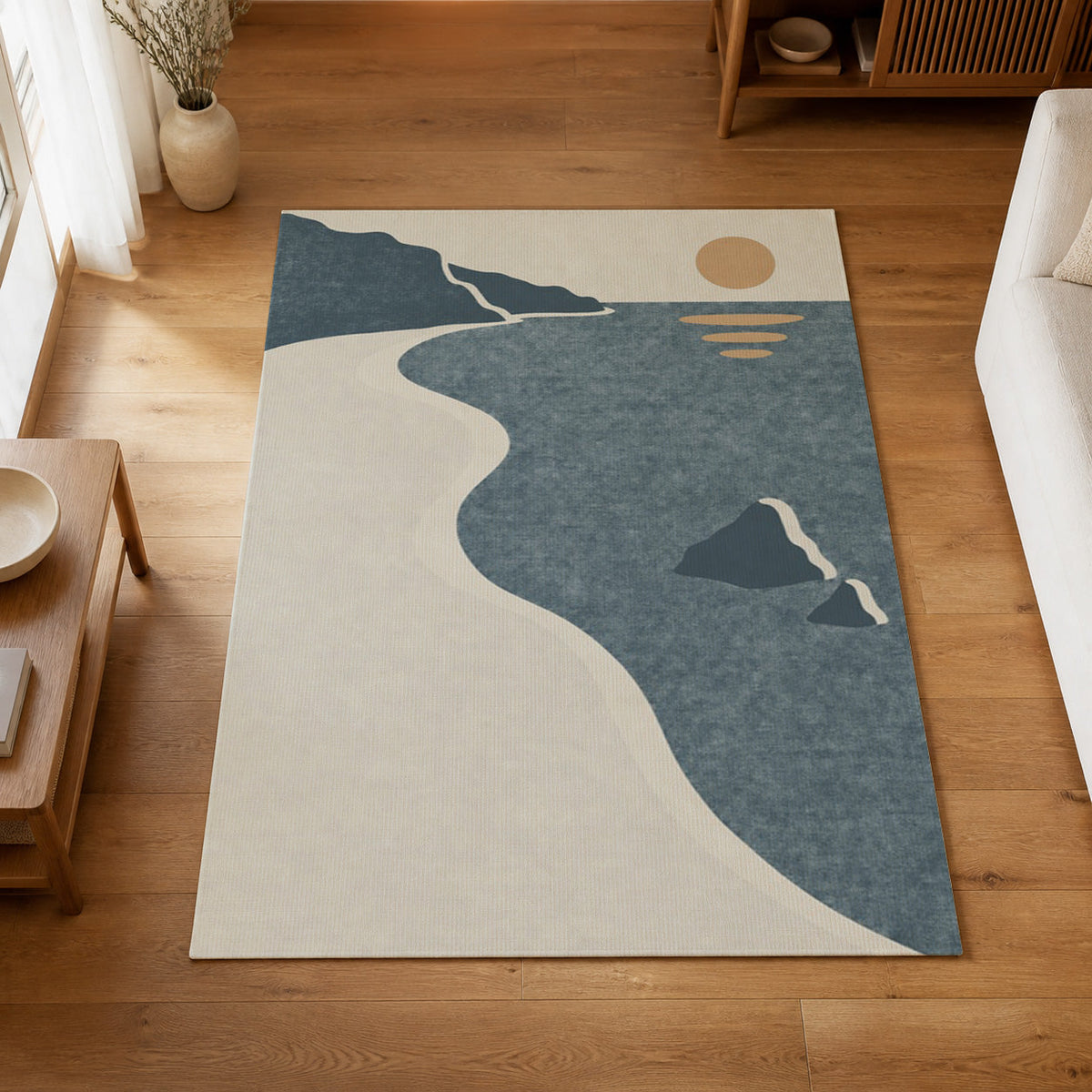 Kartela Shoreline washable coastal sunset area rug in Blue, on a wooden floor in a bright living room