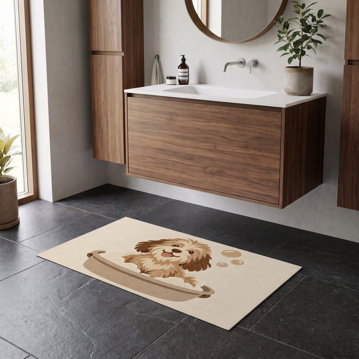 Kartela Bath Pup washable dog bath mat in Beige, on a dark tile floor in front of a wooden vanity