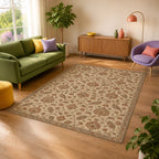 Kartela Persian Field washable vintage Persian style area rug in Beige, in a sunny living room with a green sofa
