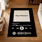 Personalized song rug with a photo, song title and artist in a music-player design, on a wooden living room floor