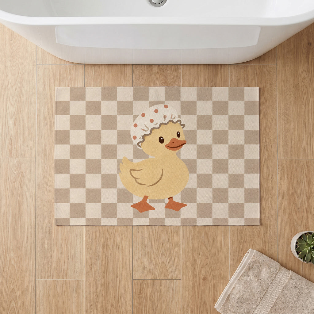 Kartela Duck Check washable checkered duck bath mat in Beige, on a wooden floor in front of a bathtub