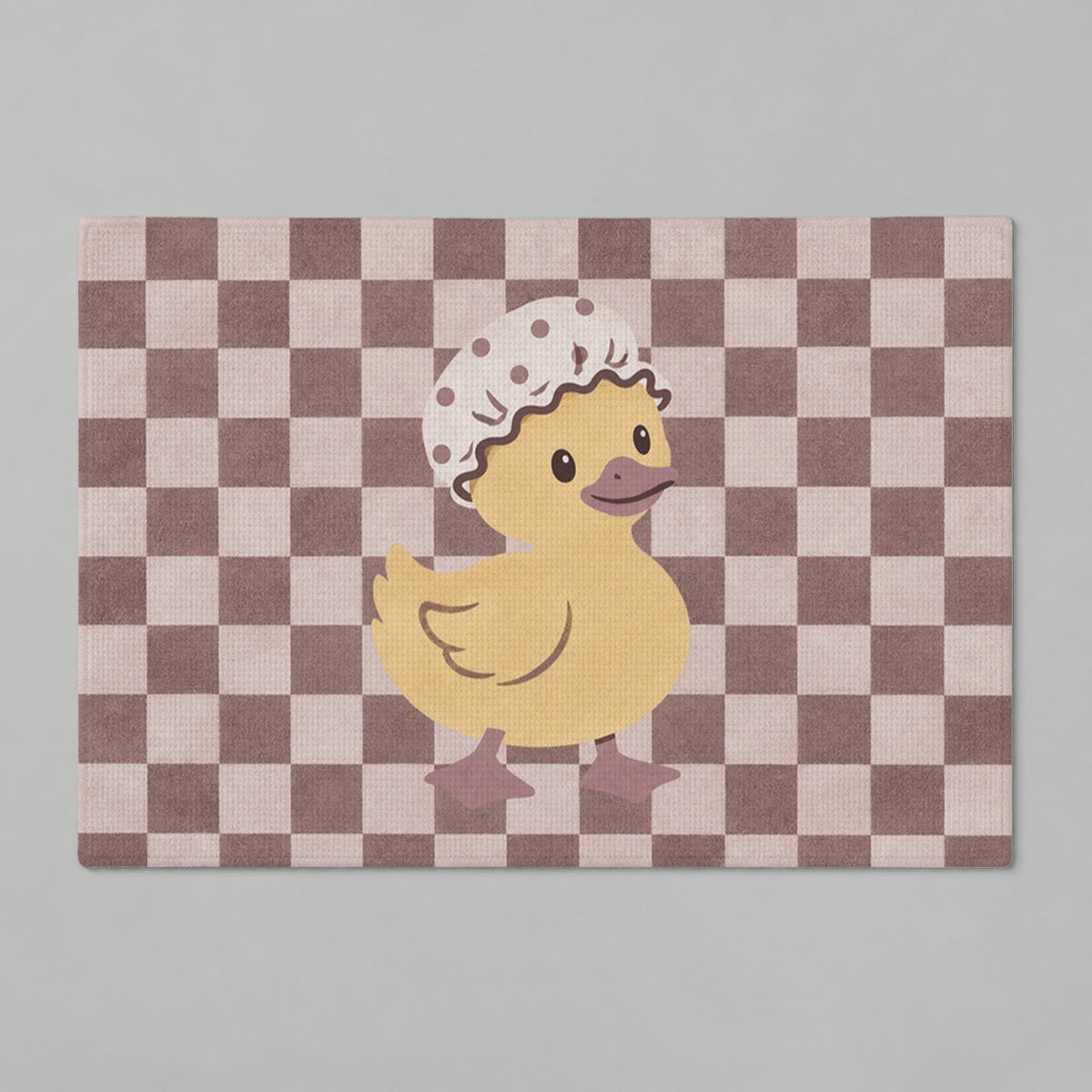 Kartela Duck Check washable checkered duck bath mat in Dusty Rose, flat product view on a gray background
