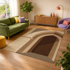 Kartela Stone Arch washable architectural arch area rug in Beige, in a sunny living room with a green sofa