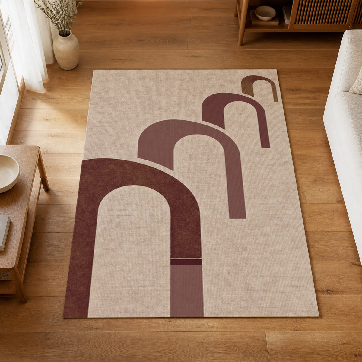 Kartela Echo washable modern arch pattern area rug in Burgundy, on a wooden floor in a bright living room