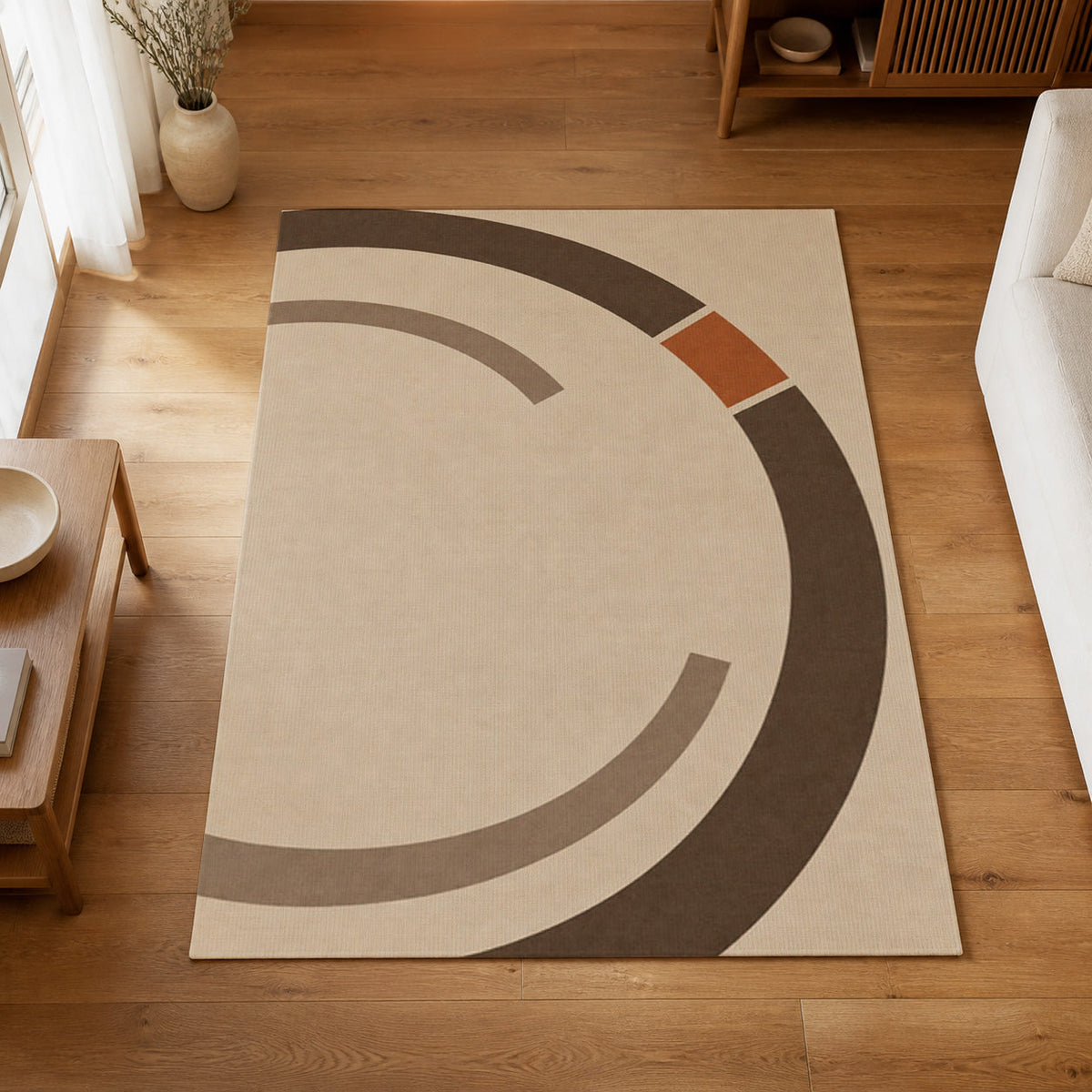 Kartela Orbit washable modern circle area rug in Beige, on a wooden floor in a bright living room