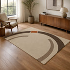 Kartela Orbit washable modern circle area rug in Beige, in a living room with an armchair and sideboard