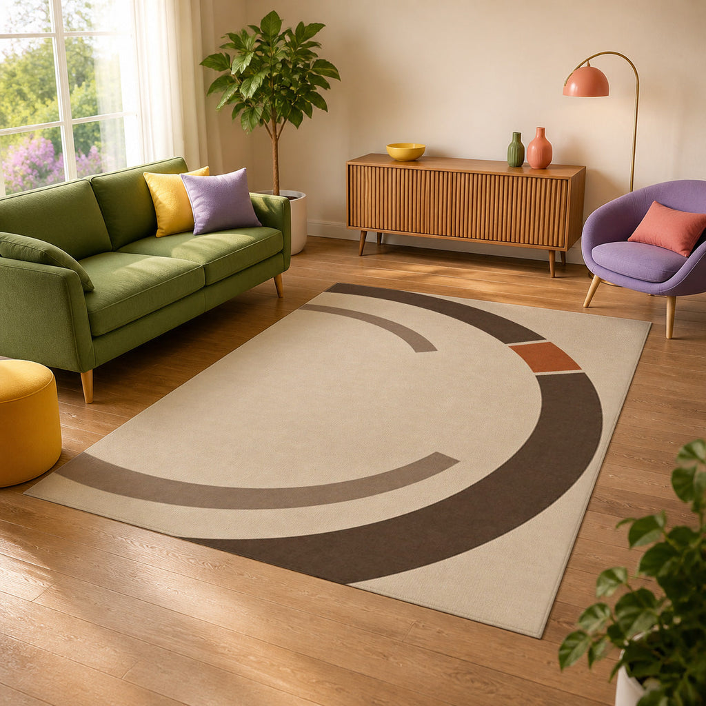 Kartela Orbit washable modern circle area rug in Beige, in a sunny living room with a green sofa