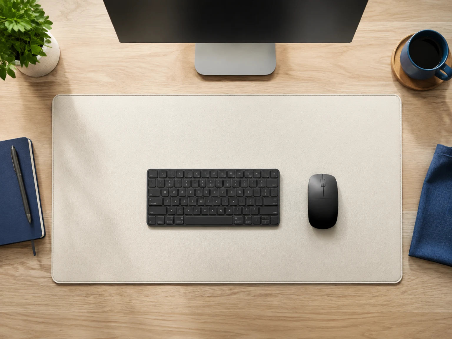 Minimal desk setup showing how desk mat sizes fit beneath a keyboard and mouse